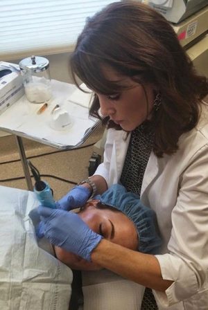 Patient receiving microneedling